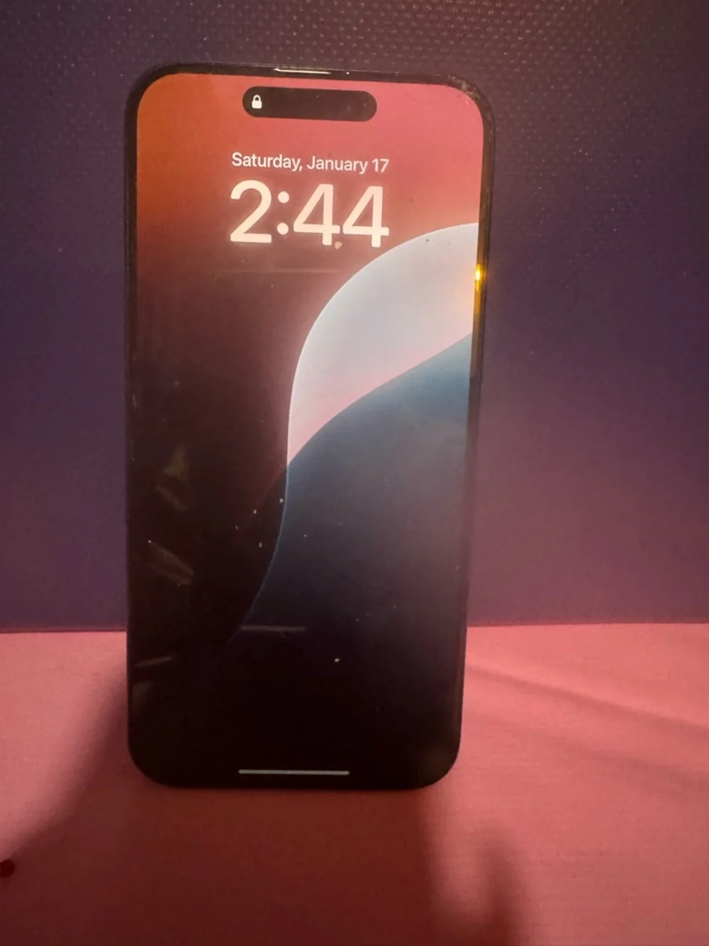 Apple iPhone with Pink Gradient Lock Screen Accent